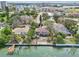 Overhead view displaying homes on waterfront, complete with docks and city views at 9300 Gulf Blvd, St Pete Beach, FL 33706