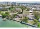 Scenic aerial view of waterfront homes, docks, and lush greenery with water views at 9300 Gulf Blvd, St Pete Beach, FL 33706