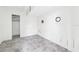 Bedroom with two porthole-shaped windows, white walls, and tile flooring at 9300 Gulf Blvd, St Pete Beach, FL 33706