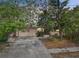 Charming single Gathering home with mature landscaping and attached one car garage at 9300 Gulf Blvd, St Pete Beach, FL 33706