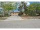 Charming single-story home with attached garage and well-maintained front yard at 9300 Gulf Blvd, St Pete Beach, FL 33706