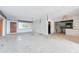 Open-concept living space leading to kitchen, awaits transformation and creative renovation ideas at 9300 Gulf Blvd, St Pete Beach, FL 33706