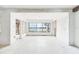Bright living room with large windows and waterfront view offers flexible living space at 9300 Gulf Blvd, St Pete Beach, FL 33706
