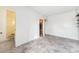 Empty room with bathroom, wood walls and tiled floor at 9300 Gulf Blvd, St Pete Beach, FL 33706