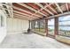 Sun room with wood ceilings, multiple windows offering water views, and a unique fireplace at 9300 Gulf Blvd, St Pete Beach, FL 33706