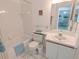 Clean and well-maintained bathroom with tiled walls, updated fixtures, and a functional layout at 967 Waterside Ln # 1, Bradenton, FL 34209
