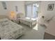Comfortable bedroom with twin beds, ample natural light, and a peaceful ambiance at 967 Waterside Ln # 1, Bradenton, FL 34209