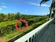 A tranquil marsh view is visible from the porch with lush greenery and a peaceful body of water at 967 Waterside Ln # 1, Bradenton, FL 34209