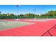 Well-maintained community tennis courts surrounded by lush landscaping and shaded benches at 967 Waterside Ln # 1, Bradenton, FL 34209