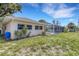 Spacious backyard featuring lush landscaping and a private pool at 1026 Graham Rd, Venice, FL 34293