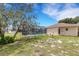 Scenic view of backyard with screened pool and meticulously kept lawn at 1026 Graham Rd, Venice, FL 34293
