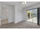 Bedroom with sliding glass door and a closet, offering access and views of the outdoor pool area at 1026 Graham Rd, Venice, FL 34293