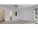 Bedroom featuring neutral carpeting, ceiling fan and a door to the bathroom at 1026 Graham Rd, Venice, FL 34293