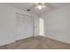Bedroom featuring a ceiling fan, closet and neutral carpeting at 1026 Graham Rd, Venice, FL 34293