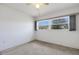 Bedroom featuring neutral carpeting and a large window at 1026 Graham Rd, Venice, FL 34293