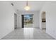 Dining area with tile flooring and sliding glass doors providing views of the pool area at 1026 Graham Rd, Venice, FL 34293