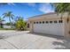 Attached garage with a wide driveway and lovely front yard at 1026 Graham Rd, Venice, FL 34293