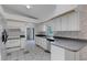 Spacious kitchen featuring white appliances and decorative backsplash at 1026 Graham Rd, Venice, FL 34293