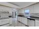 Kitchen sink and dishwasher overlooking the pool area at 1026 Graham Rd, Venice, FL 34293