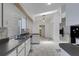Bright eat-in kitchen with white cabinets and tile floors at 1026 Graham Rd, Venice, FL 34293