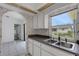 Bright kitchen with white cabinets, tile floors, and neutral walls at 1026 Graham Rd, Venice, FL 34293