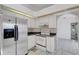Eat-in kitchen featuring white appliances and decorative backsplash at 1026 Graham Rd, Venice, FL 34293