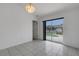 Bright room with tile floors and sliding glass doors to the pool area at 1026 Graham Rd, Venice, FL 34293