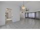 Open-concept living room with tile flooring and arched doorway at 1026 Graham Rd, Venice, FL 34293