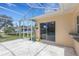 Covered patio with view to the screened pool and adjacent to the home at 1026 Graham Rd, Venice, FL 34293