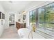 Bright bathroom with soaking tub, double vanity, and large windows offering lots of natural light at 128 Fillmore Dr, Sarasota, FL 34236