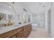 Bright primary bath features a double vanity, a soaking tub and large walk-in shower at 128 Fillmore Dr, Sarasota, FL 34236