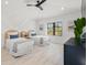 Bright bedroom with two beds, stylish ceiling fan, and decorative wall paneling at 128 Fillmore Dr, Sarasota, FL 34236