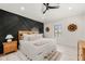 Bedroom with a tray ceiling, decorative wall, and natural light at 128 Fillmore Dr, Sarasota, FL 34236