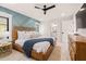 Comfortable bedroom featuring a statement wall, stylish decor, connecting bathroom, and ample storage at 128 Fillmore Dr, Sarasota, FL 34236