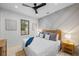 Cozy bedroom with a geometric accent wall, lots of natural light, and minimalist décor at 128 Fillmore Dr, Sarasota, FL 34236