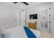 Bright bedroom featuring modern décor, an ensuite bathroom, and closet at 128 Fillmore Dr, Sarasota, FL 34236