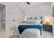 Primary bedroom featuring a patterned accent wall and lots of natural light at 128 Fillmore Dr, Sarasota, FL 34236