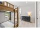 bedroom with wooden bunk beds and view into attached bathroom at 128 Fillmore Dr, Sarasota, FL 34236