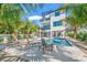 Gorgeous home featuring an outdoor pool, spiral staircase, cabana, and tropical foliage, creating an entertainer's paradise at 128 Fillmore Dr, Sarasota, FL 34236
