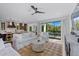 Spacious living room adjacent to the kitchen, offering seamless entertaining options at 128 Fillmore Dr, Sarasota, FL 34236