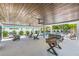 Expansive outdoor living space with ceiling fans, foosball table, seating and a refreshing pool area at 128 Fillmore Dr, Sarasota, FL 34236
