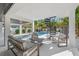 Stylish outdoor living area with modern seating, spiral staircase, and a refreshing pool at 128 Fillmore Dr, Sarasota, FL 34236