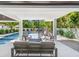 Elegant outdoor space featuring a comfortable seating area, a modern pool, and a spiral staircase at 128 Fillmore Dr, Sarasota, FL 34236