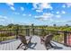 Relaxing rooftop deck with comfortable Adirondack chairs and expansive views of the surrounding neighborhood at 128 Fillmore Dr, Sarasota, FL 34236