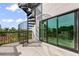 Spiral staircase leading to a rooftop deck with ocean view at 128 Fillmore Dr, Sarasota, FL 34236