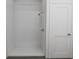 Modern shower featuring white walls, chrome fixtures, and glass door at 13046 Bayberry Way, Parrish, FL 34219