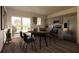 Bright dining area adjacent to the kitchen, featuring a modern table, chairs, and sliding glass door to the yard at 13046 Bayberry Way, Parrish, FL 34219