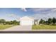 Inviting single-story home boasts a well-manicured lawn, a two-car garage, and lush landscaping at 13046 Bayberry Way, Parrish, FL 34219