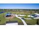 Aerial view of community park with playground, picnic area, and walking paths amid lush landscaping at 13117 Bayberry Way, Parrish, FL 34219