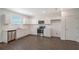 Modern kitchen featuring stainless steel appliances, white cabinets, and sleek countertops, ideal for culinary enthusiasts at 13117 Bayberry Way, Parrish, FL 34219